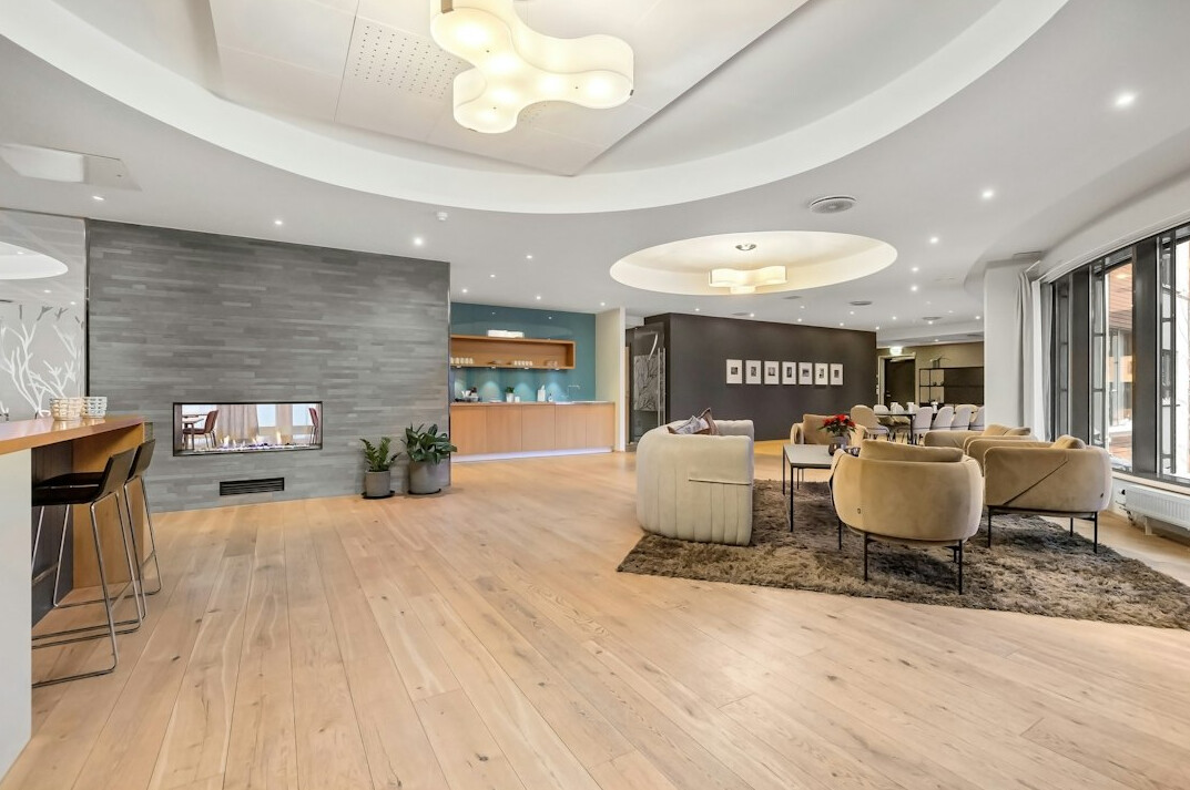 Bright modern office reception area with plants